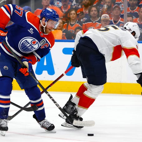 Game 2: Edmonton Oilers center Connor McDavid (97) skates past Florida Panthers defenseman Aaron Ekblad (5) before feeding Leon Draisaitl for a first-period goal.