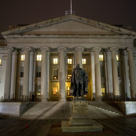 The United States Treasury Building at night in Washington D.C.