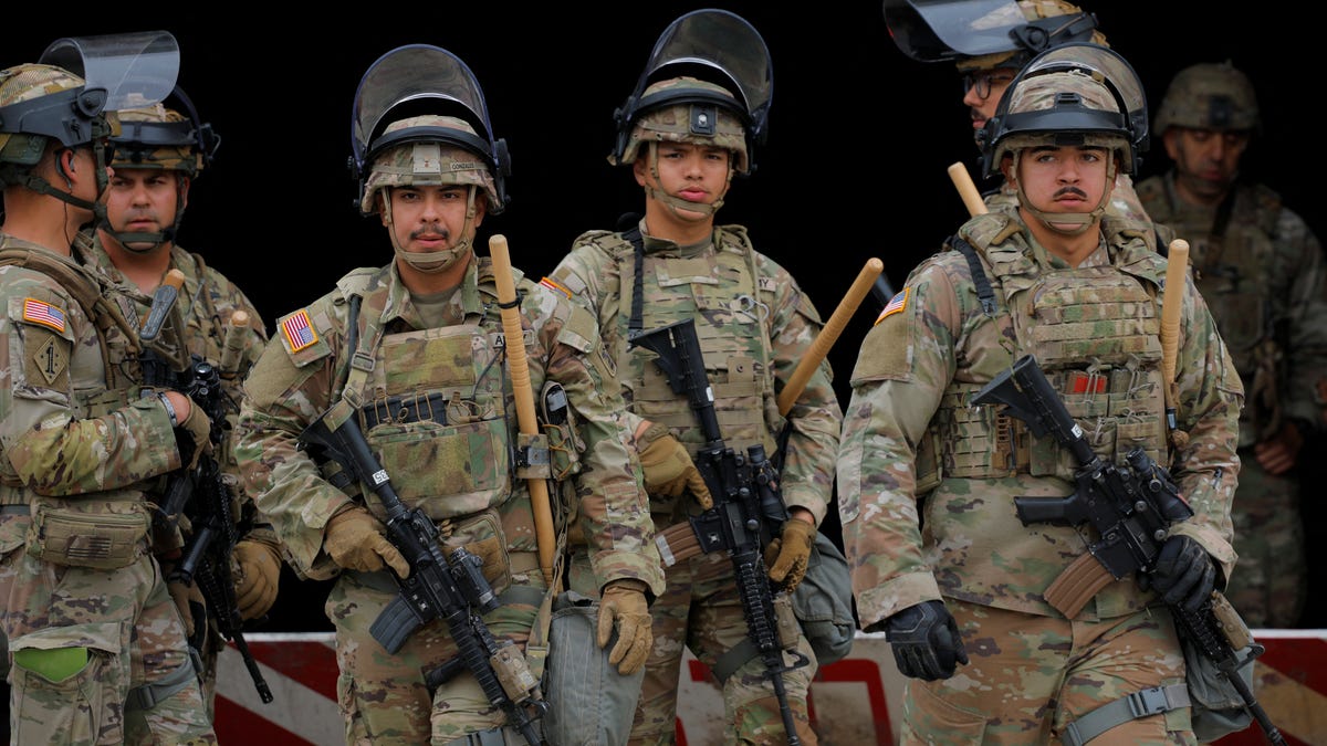 Members of the California National Guard stand outside the Edward R. Roybal federal building in Los Angeles, California,on June 8, 2025.