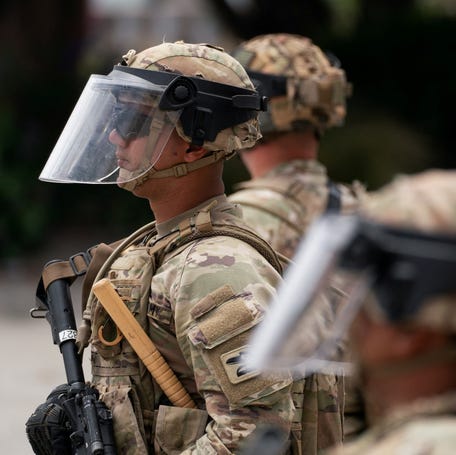 California National Guard personnel, deployed by President Donald Trump in response to protests against immigration sweeps, stand at attention in Los Angeles on June 8, 2025.