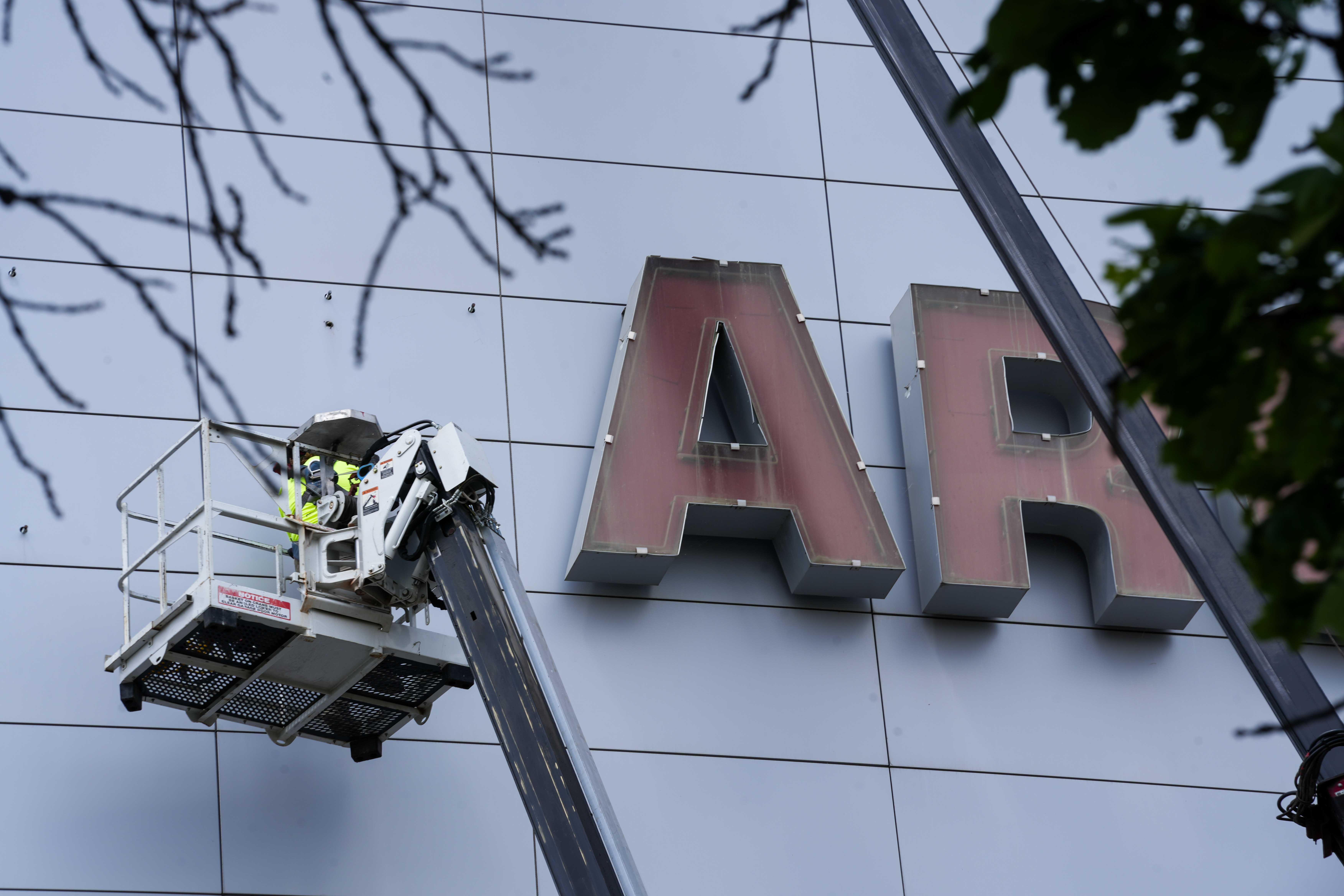 CDATA[## The AI Revolution in Finance: Threat or Opportunity?
Technology has a history of steamrolling workers—from scribes to switchboard operators, innovation often renders occupations obsolete. Economists call this **"creative destruction."** Now, the rise of **artificial intelligence (AI)** has experts speculating that bankers and financiers could be next.
A **Citigroup study** found that AI has the potential to replace more than **50% of finance industry jobs**. This could be dire for cities like **Des Moines**, where banking and finance account for **29% of the metro area's GDP** and employ over **53,000 people**.
![Wells Fargo Arena signage removal