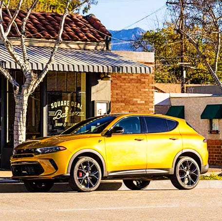 A yellow Dodge Hornet small SUV