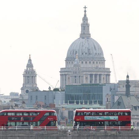 London buses cross Waterloo Bridge with St. Paul's Cathedral seen behind, on the day when trade talks are due to take place in London between the U.S. and China, in London, Britain, June 9, 2025.