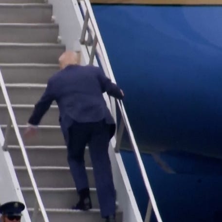 President Trump appeared to trip up the steps to Air Force One en route to Camp David