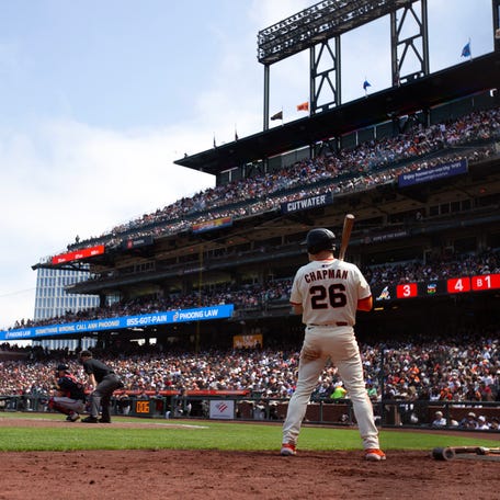 San Francisco Giants third baseman Matt Chapman stands in the on deck circle while Wilmer Flores bats against the Atlanta Braves during the eighth inning at Oracle Park.