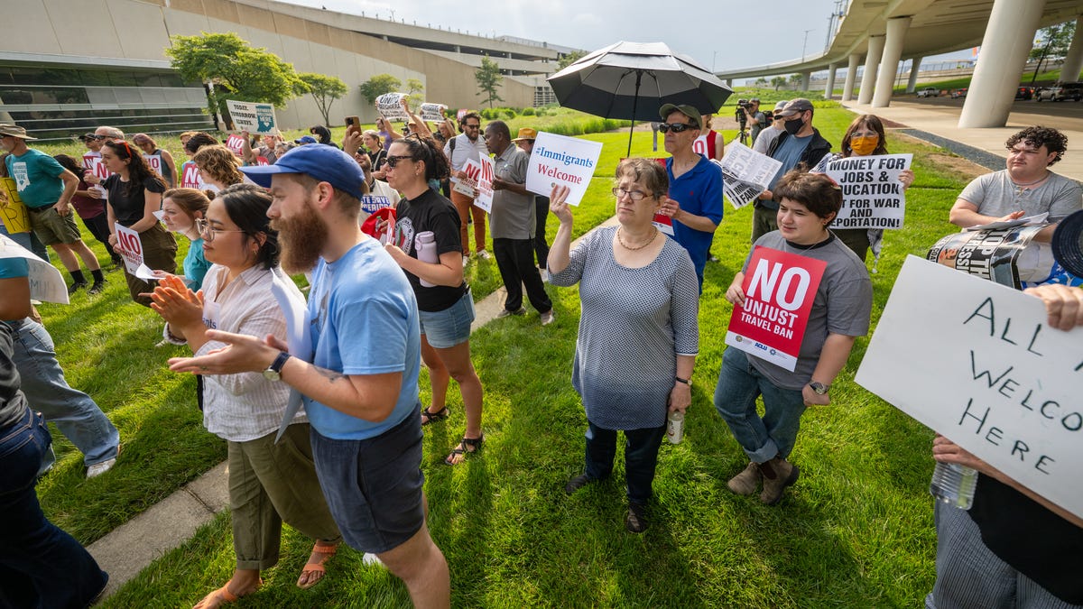 Protesters at Indianapolis International Airport speak out against Trump's ...