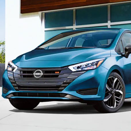 A blue 2025 Nissan Versa SR subcompact car.