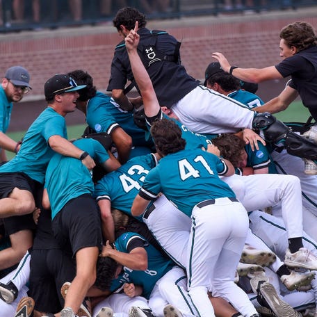 Coastal Carolina players celebrate after earning a spot in the College World Series after their defeat of Auburn in the NCAA baseball tournament super regionals at Plainsman Park in Auburn, Ala.