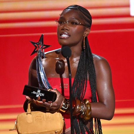 Doechii accepts the Best Female Hip-hop Artist award.
