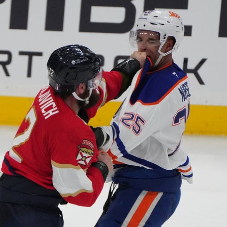 Game 3: Florida Panthers forward Jonah Gadjovich (12) and Edmonton Oilers defenseman Darnell Nurse (25) fight during the third period.