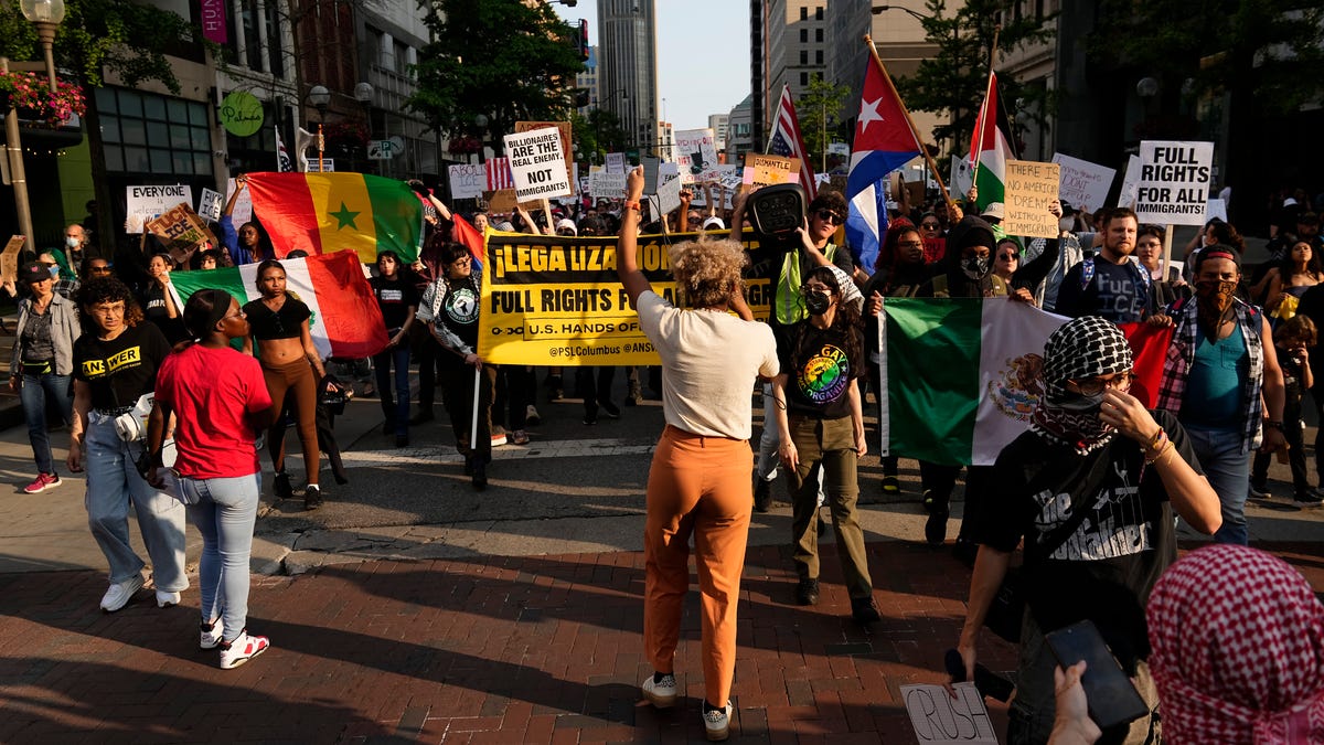 See photos of protesters against ICE deportations marching through ...
