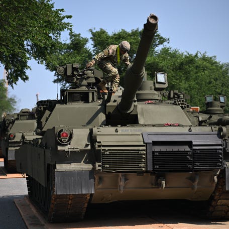 A soldier is seen on top of a M1 Abrams tank during a media preview of the Army's Parade at West Potomac Park in Washington, D.C., on June 11, 2025. A military parade and celebration of the 250th birthday of the US Army will be held in Washington, D.C., on June 14, which also coincides with President Donald Trump's 79th birthday.