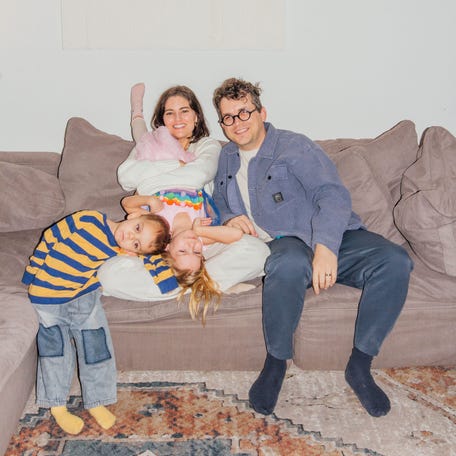 Haven and Aaron Weits poses on the couch with their children Eko Weits, 3, and Eisley Weits, in Los Angeles, California.