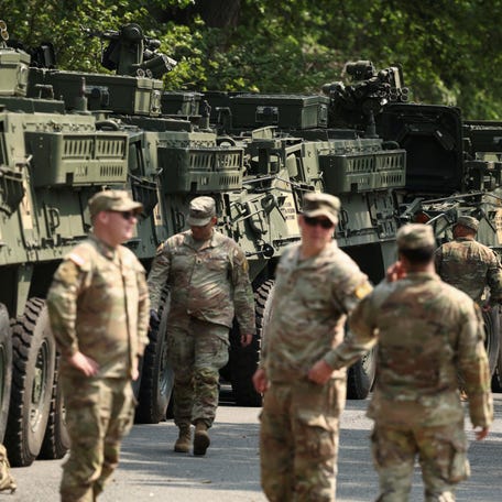 Soldiers tend to Stryker armored vehicles ahead of the upcoming U.S. Army 250th anniversary celebration parade in Washington, D.C., U.S., June 11, 2025. REUTERS/Kevin Lamarque