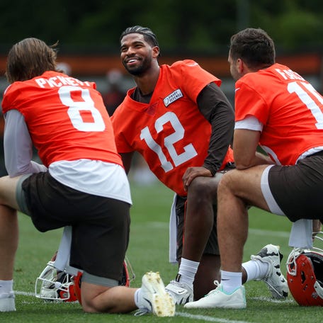 Browns quarterbacks Shedeur Sanders (12), Kenny Pickett (8) and Joe Flacco (15) talk during minicamp, Tuesday, June 10, 2025, in Berea.