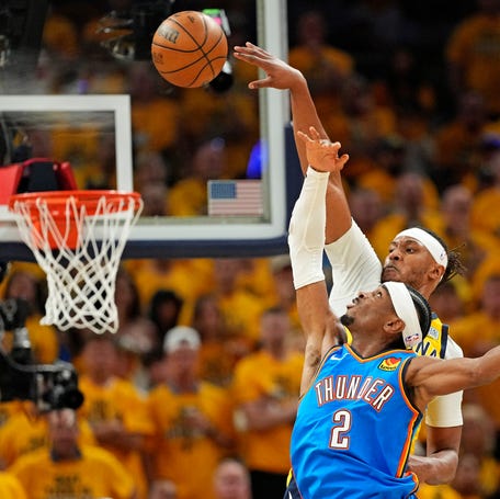The Indiana Pacers' Myles Turner (33) blocks a shot by Shai Gilgeous-Alexander.