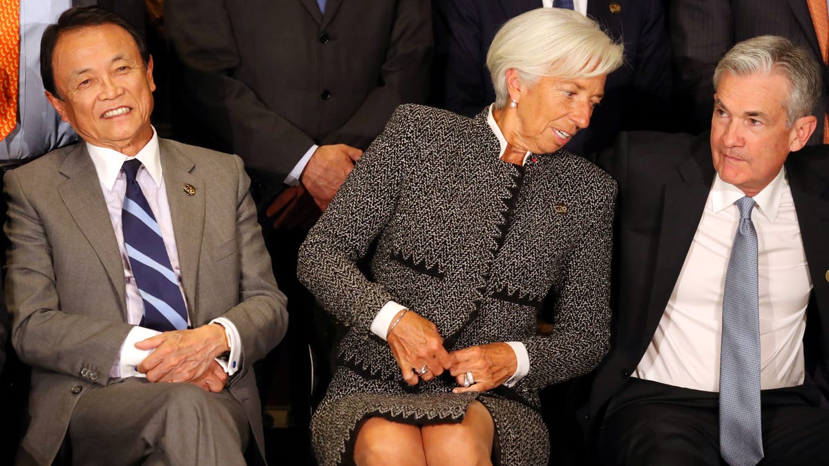 Christine Lagarde, the current president of the European Central Bank, sits alongside Federal Reserve Chair Jerome Powell.