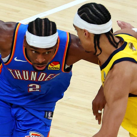 Andrew Nembhard presses Shai Gilgeous-Alexander during Game 3 of the 2025 NBA Finals at Gainbridge Fieldhouse.