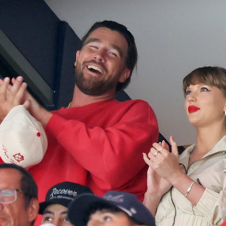 Travis Kelce, left, and Taylor Swift watch as the Edmonton Oilers and the Florida Panthers play during the first period in Game 4 of the 2025 Stanley Cup Final at Amerant Bank Arena on June 12, 2025, in Sunrise, Florida.