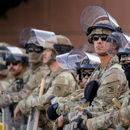 National Guard troops are pictured guarding the Edward R. Roybal Federal Building in Los Angeles.