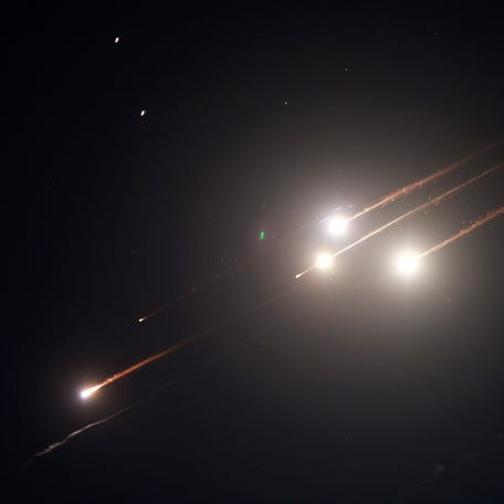 Rocket trails light up the sky above Jerusalem on June 13, 2025. Air raid sirens sounded in Jerusalem and loud blasts were heard on June 13, AFP journalists reported, as the Israeli military said it had detected a missile launched from Iran.