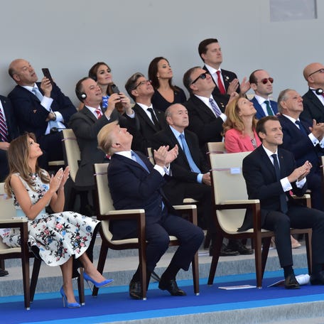 (from left) U.S. First Lady Melania Trump, U.S. President Donald Trump, French President Emmanuel Macron and his wife Brigitte Macron attend the traditional Bastille Day military parade on the Champs-Elysees avenue in Paris, France, July 14, 2017. REUTERS/Christophe Archambault/Pool