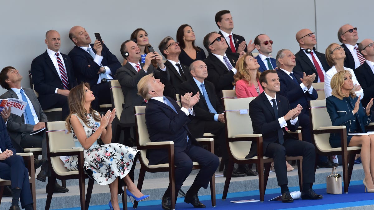 (from left) U.S. First Lady Melania Trump, U.S. President Donald Trump, French President Emmanuel Macron and his wife Brigitte Macron attend the traditional Bastille Day military parade on the Champs-Elysees avenue in Paris, France, July 14, 2017. REUTERS/Christophe Archambault/Pool