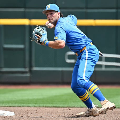 Jun 14, 2025; Omaha, Neb, USA; UCLA Bruins shortstop Roch Cholowsky (1) completes a double play against the Murray State Racers during the second inning at Charles Schwab Field. Mandatory Credit: Steven Branscombe-Imagn Images