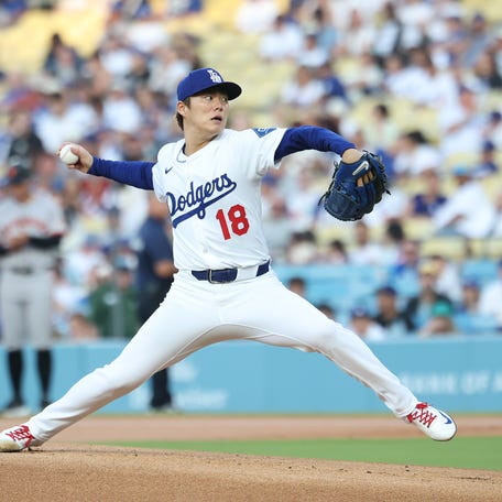 Jun 13, 2025; Los Angeles, California, USA; Los Angeles Dodgers starting pitcher Yoshinobu Yamamoto (18) pitches during the first inning against the San Francisco Giants at Dodger Stadium. Mandatory Credit: William Navarro-Imagn Images