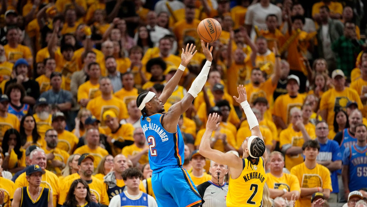 Thunder guard Shai Gilgeous-Alexander shoots the ball over Pacers guard Andrew Nembhard during the second half.