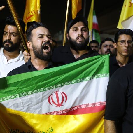 People attend a protest against Israeli strikes on Iran, in Baghdad, Iraq, June 13, 2025.