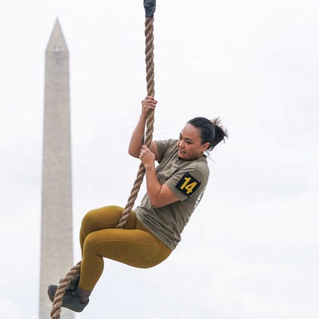 A member of the U.S. Army takes part in a fitness competition in front of the Washington Monument on the day of a military parade to commemorate the U.S. Army's 250th Birthday in Washington, D.C., U.S., June 14, 2025.