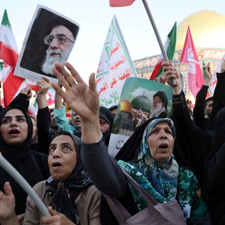 People attend an anti-Israeli rally following the Israeli strikes on Iran, in Tehran, Iran, June 14, 2025.