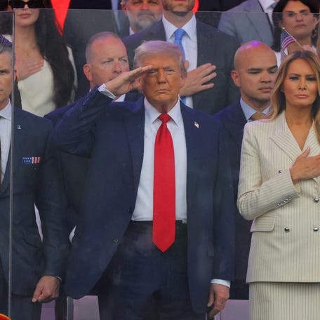 President Donald Trump, first lady Melania Trump and U.S. Secretary of Defense Pete Hegseth salute as they attend a military parade to commemorate the U.S. Army's 250th Birthday, on the day of U.S. President Donald Trump 79th birthday, in Washington, D.C., U.S., June 14, 2025.