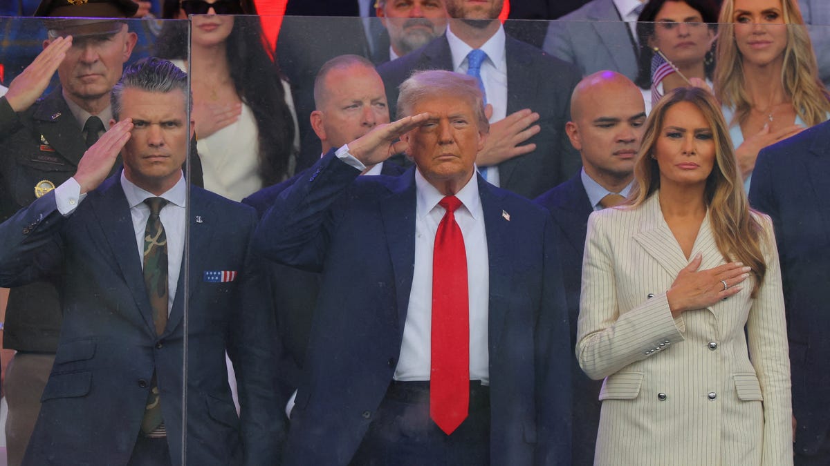President Donald Trump, first lady Melania Trump and U.S. Secretary of Defense Pete Hegseth salute as they attend a military parade to commemorate the U.S. Army's 250th Birthday, on the day of U.S. President Donald Trump 79th birthday, in Washington, D.C., U.S., June 14, 2025.