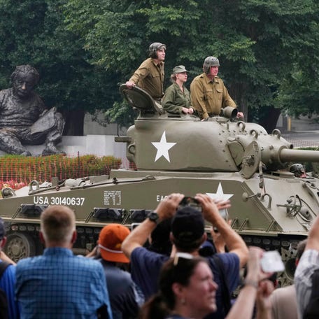 Parade participants drive a WWII era Sherman tank during a celebration marking the 250th anniversary of the U.S. Army in Washington, D.C., on June 14, 2025.