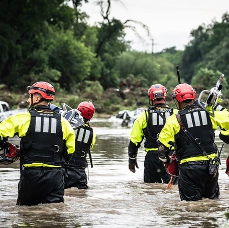 A provided image show members of the San Antonio Fire Department working during recent flooding.