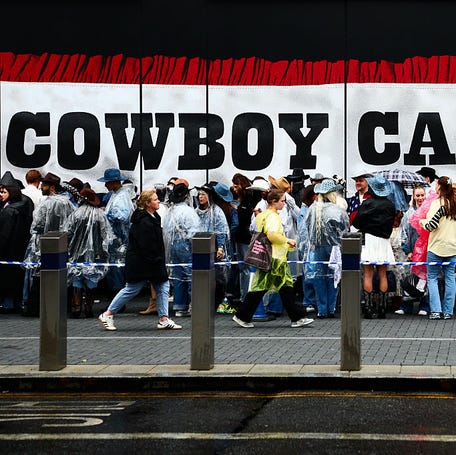 LONDON, ENGLAND - JUNE 7: Beyonce fans, also known as the "BeyHive", queue in the rain for entry at Tottenham Hotspur Stadium ahead of her second performance on June 7, 2025 in London, England. The more dedicated fans of singer Beyonce are known as "The BeyHive" have turned out en masse to her Cowboy Carter tour, dressing in chaps and cowboy hats in tribute to the singer. Beyonce is performing for six nights at the Tottenham Hotspur Football Stadium, appearing on stage   with her daughters Blue Ivy, 13, and Rumi, 8. (Photo by Alishia Abodunde/Getty Images)