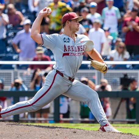 June 16: Arkansas Razorbacks starting pitcher Gage Wood (14) pitches against the Murray State Racers at Charles Schwab Field in Omaha, Nebraska. Wood recorded an incredible 19 strikeouts in the game.