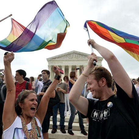 People celebrate outside the Supreme Court in Washington, DC, on June 26, 2015, after its historic decision legalizing same-sex marriage nationwide.
