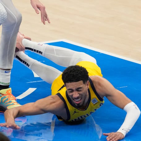 Pacers guard Tyrese Haliburton stumbled, then lost the ball during the first quarter of NBA Finals Game 5. He grabbed his right calf area after he got up, went to the locker room and returned in the second quarter.