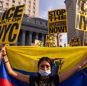 A protester holds the flag of Ecuador at a rally against immigration sweeps on June 10, 2025, in New York City.