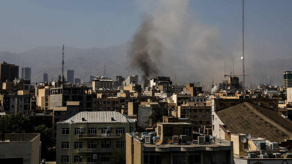 Smoke rises from an explosion following the Israeli strikes on Iran, in Tehran, Iran, June 15, 2025. Hamid Amlashi/WANA (West Asia News Agency) via REUTERS ATTENTION EDITORS - THIS PICTURE WAS PROVIDED BY A THIRD PARTY