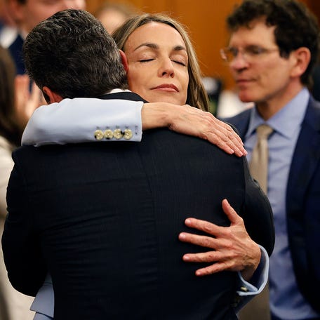 Karen Read hugs lawyer Alan Jackson after the verdicts are read in Norfolk Superior Court in Dedham, Massachusetts, on Wednesday, June 18, 2025