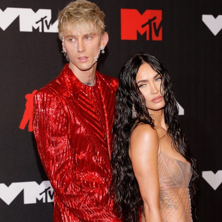 Machine Gun Kelly, left, and Megan Fox pose together while attending the 2021 MTV Video Music Awards at Barclays Center in Brooklyn, New York, on Sept. 12, 2021.