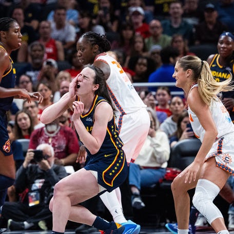 Connecticut Sun guard Jacy Sheldon (4) fouls Indiana Fever guard Caitlin Clark (22) in the second half at Gainbridge Fieldhouse on Jun 17, 2025.