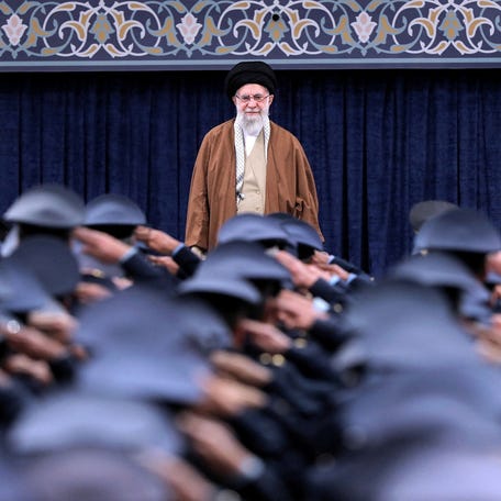ran's Supreme Leader Ayatollah Ali Khamenei listens to the national anthem as Air Force officers salute during a meeting in Tehran, on Feb. 7, 2025.