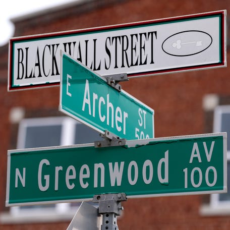 A Black Wall Street sign in Tulsa, Oklahoma, in 2025. In the early 1900s, 40 blocks to the north of downtown Tulsa boasted 10,000 residents, hundreds of businesses, medical facilities, an airport and more. On May 31, 1921, a White mob descended on Greenwood – the Black section of Tulsa – burning, looting and destroying more than 1,000 homes. Most historians who have studied the event estimate the death toll at 75 to 300.
