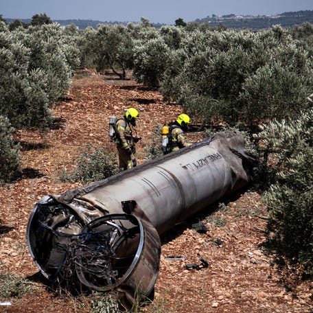 Members of the Israeli special forces check on June 18, 2025, the apparent remains of a ballistic missile lying on the ground before being evacuated from the location where they were found in northern Israel, following missile attacks by Iran.