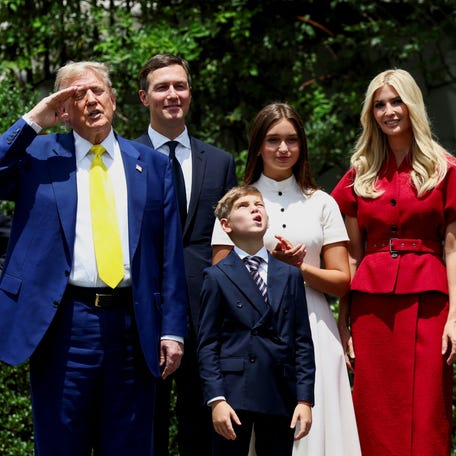 U.S. President Donald Trump, next to his daughter Ivanka Trump and her husband Jared Kushner, salutes as a U.S. flag is raised on a new flagpole installed on the South Lawn of the White House in Washington, D.C., U.S. June 18, 2025.